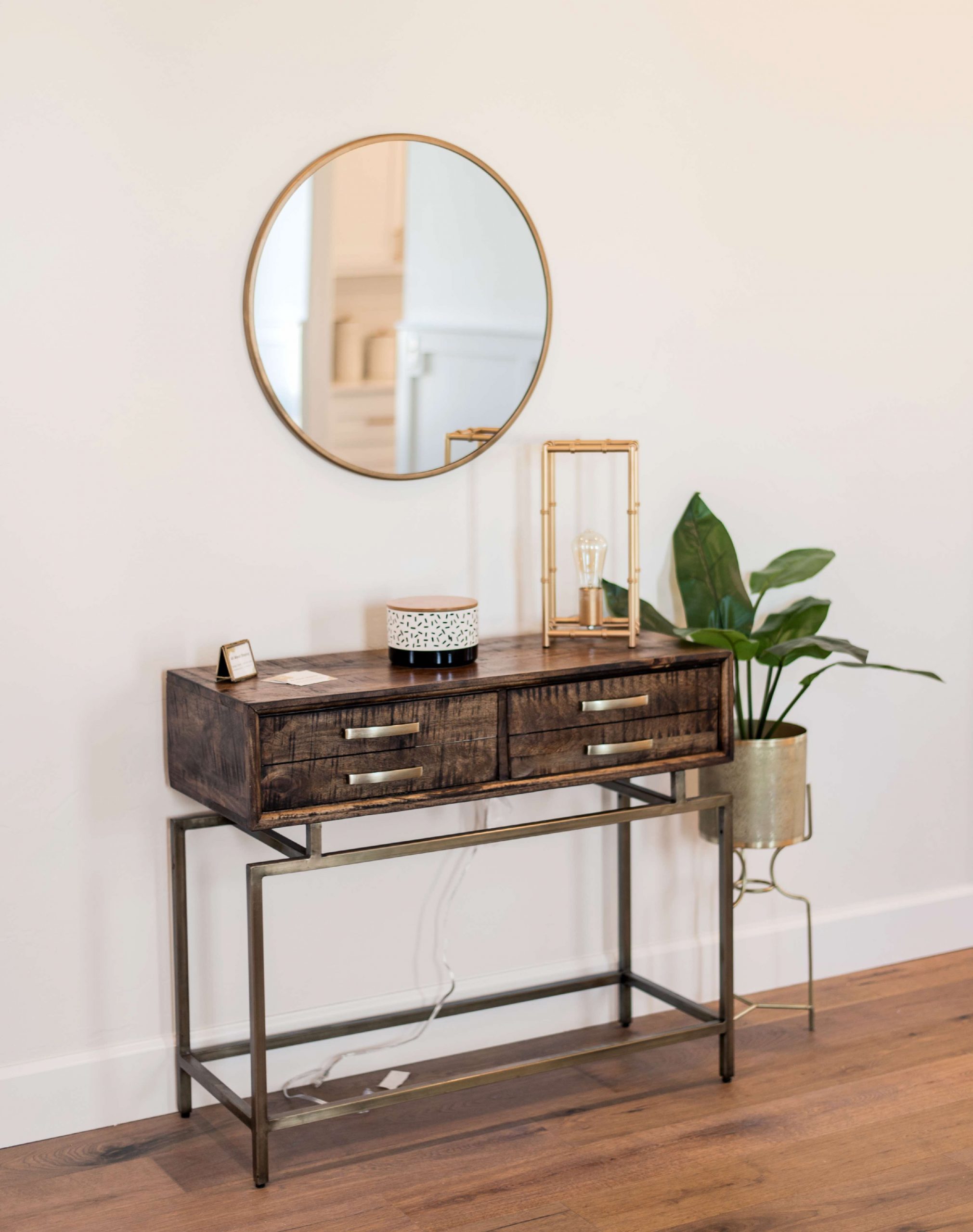 DSC_2 Wooden console table with mirror, plant, and lamp, enhancing home staging appeal for All About Staging.